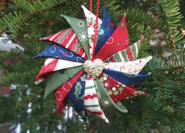 Image shows a dIY tree ornament hanging from a tree.