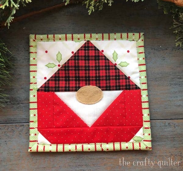 Image shows a gnome mug rug.