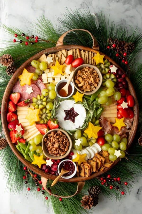 wreath charcuterie board ideas- a full board with fruit, cheese, vegetables, and more.