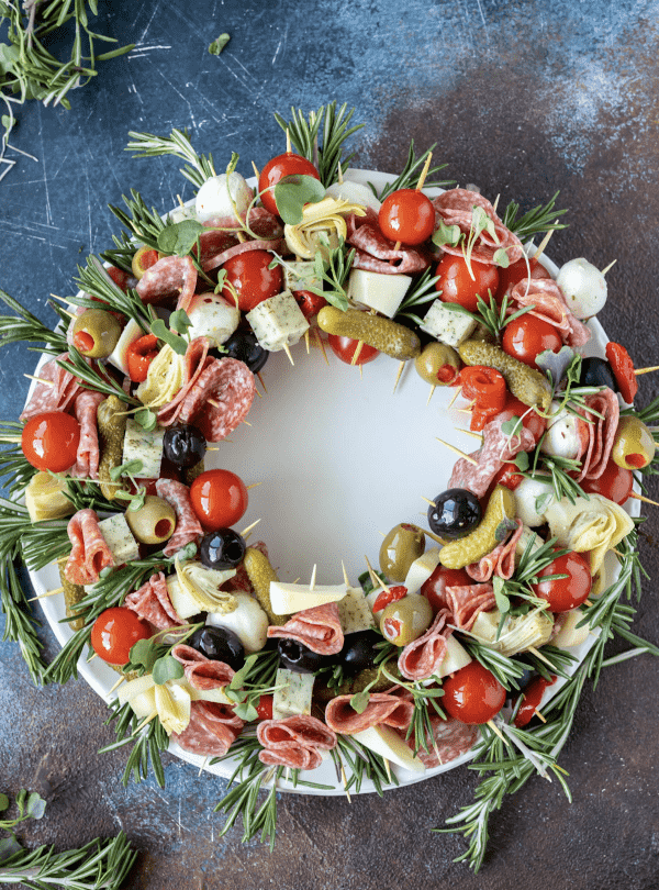 wreath charcuterie board ideas- antipasto skewers with pickles, artichokes, cucumbers, etc. 