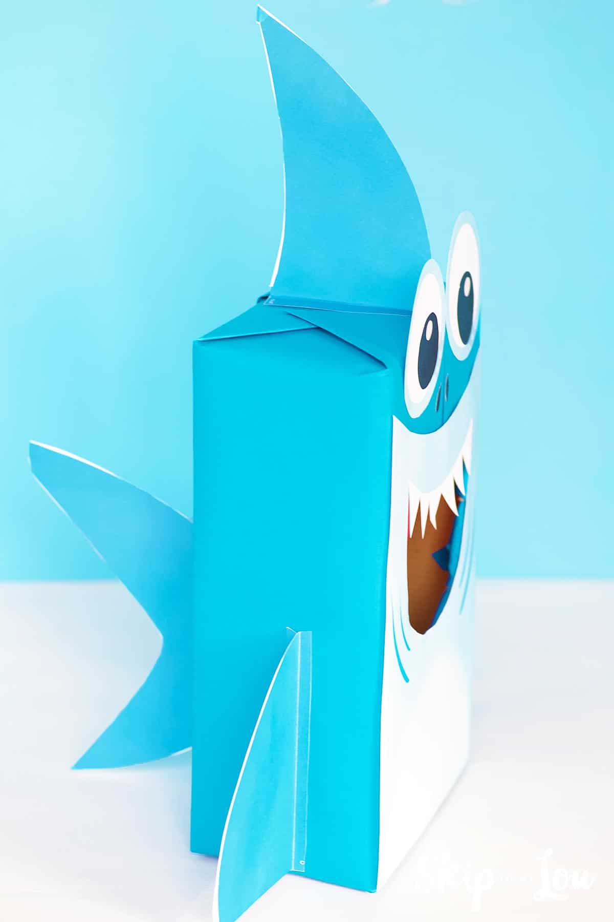 Side view of the shark Valentine box showing top, side and back fins by Skip to my Lou.