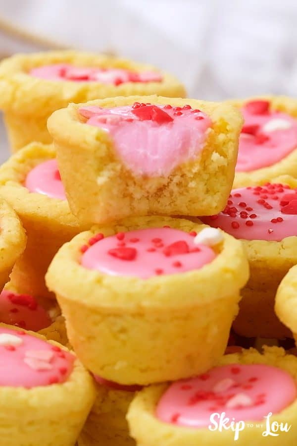 The inside of a Valentine sugar cookie cup after a bite has been taken, by Skip to my Lou.