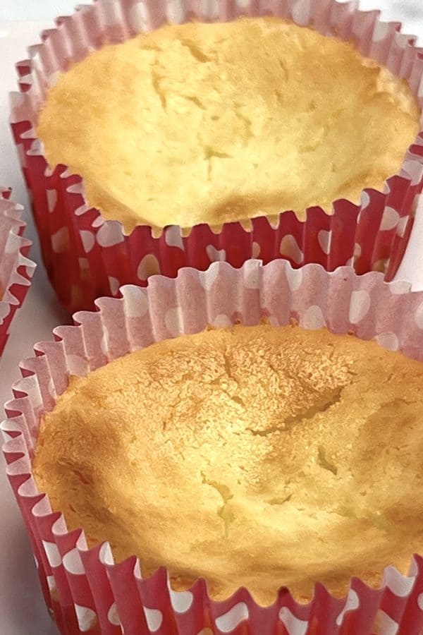 baked mini strawberry cheesecakes in pink cupcake liners