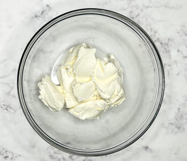 mini cheesecake tart filling in a mixing bowl