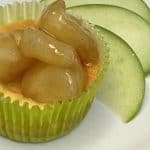 mini apple cheesecake next to fresh green apple slices