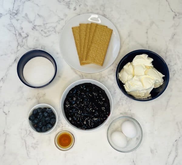 Mini blueberry cheesecake ingredients in bowls