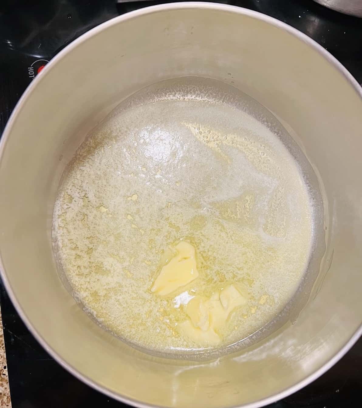 melted butter for valentine rice krispie treats in a saucepan