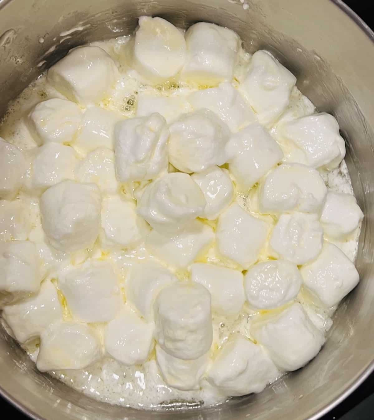 melting marshmallows in butter for valentine rice krispie treats