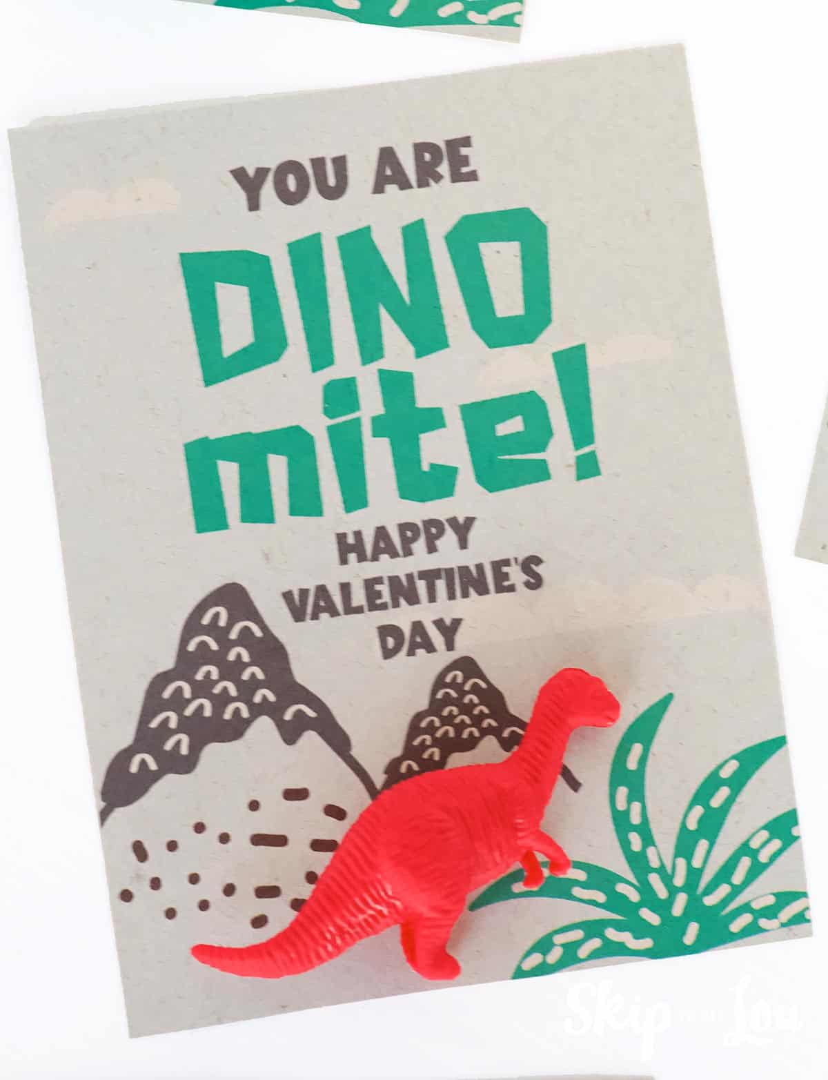 Brown card with dinosaur Valentine saying and red dinosaur eraser by Skip to my Lou.