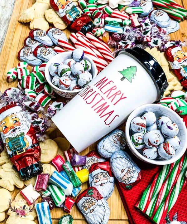 ever after in the woods-christmas candy board with candy canes and christmas themed candies