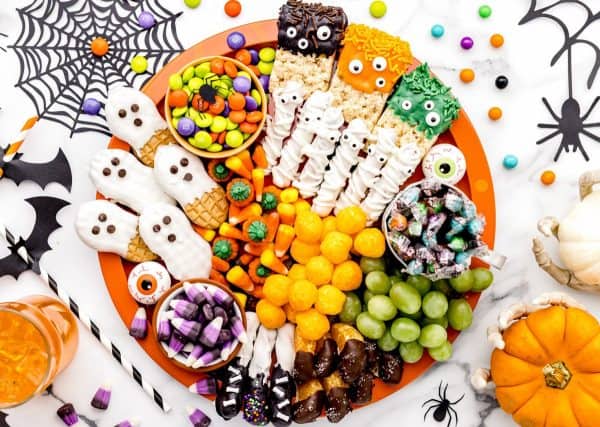 lilluna- candy charcuterie board ideas-Halloween candy board with nutter butters, cheese balls, etc
