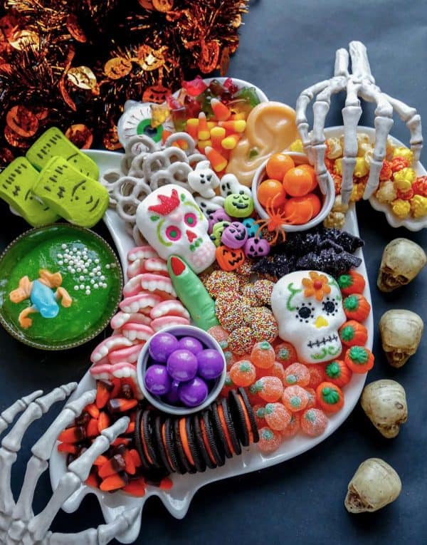 pint sized baker-halloween dessert board candies and sugar skulls
