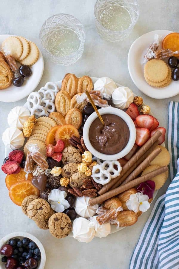 sugar and charm- candy charcuterie board ideas-dessert board with chocolate dip