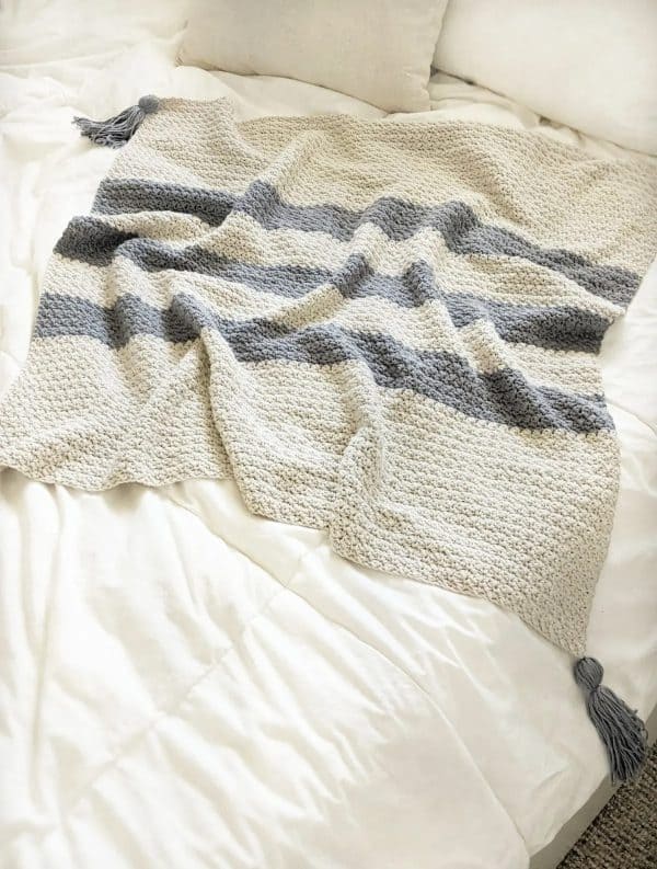 Modern striped crochet baby blanket.