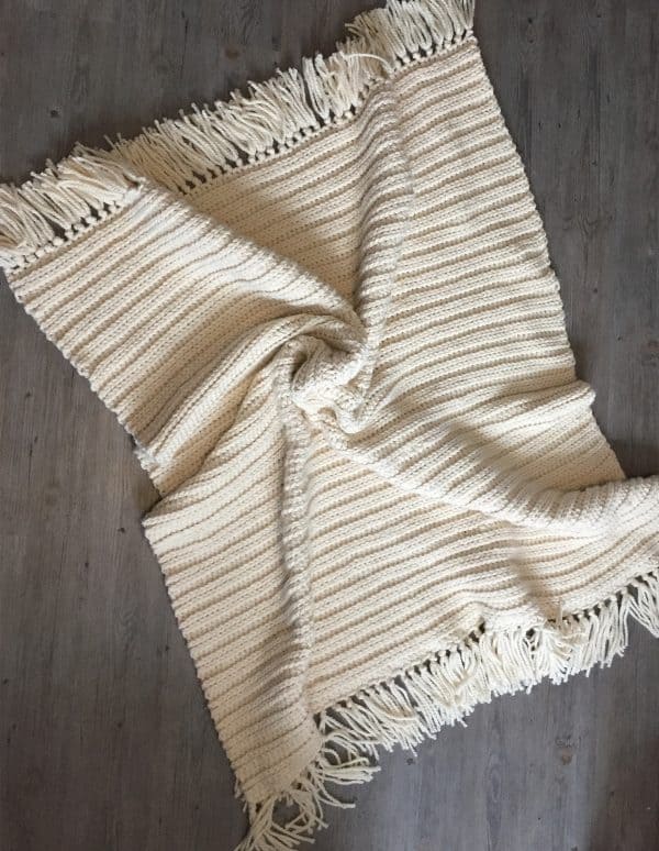 Twisted white crochet blanket.