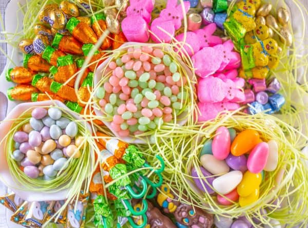 A board where you can eat anything from Abigail Albers with edible easter grass, peeps, chocolate chicks, and jelly beans.