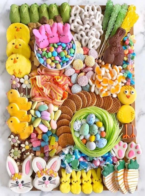 A large candy board from Ain't Too Proud To Meg inclues peeps, pretzels, rock candy and more.