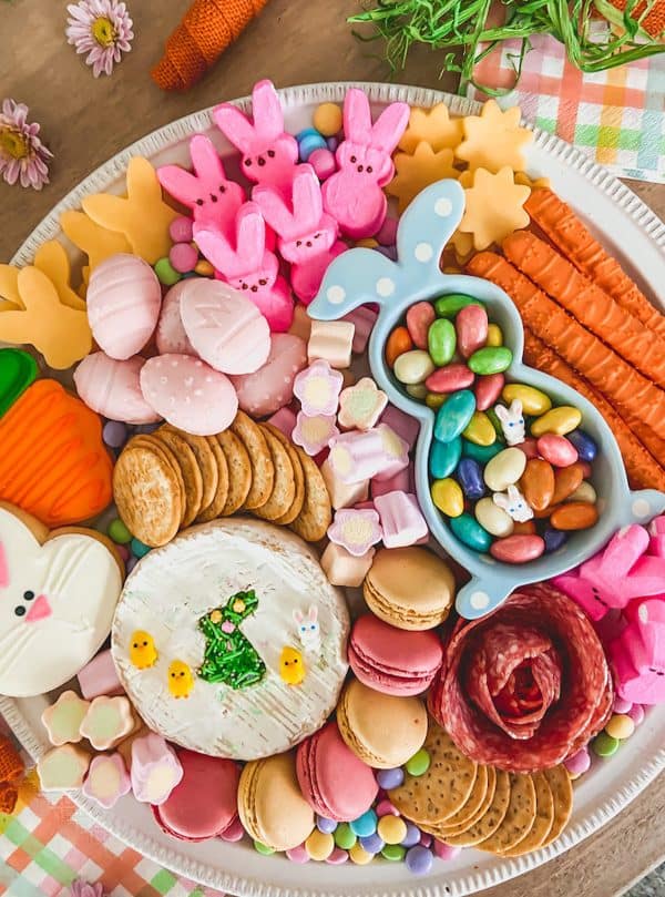 A mix of a traditional charcuterie board with some candy elements like peeps, and chocolate eggs from Life By Leanna.