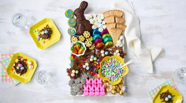 A Easter candy charcuterie board full of homemade treats like bird's nest cookies, and shortbread from Southern Living.