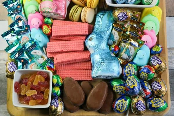 An easy to put together board with caramel eggs, chocolate bunnies, peeps, and more from Tamara (like) Camera.
