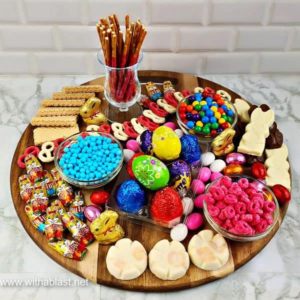 A bright board that has many different candy and sweet options like chocolate bunnies and eggs from With A Blast. 