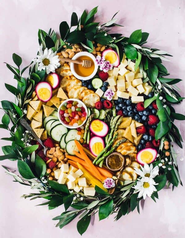 Easter charcuterie board ideas from heartbeet kitchen includes fruits, cheeses, and even some pickled beet eggs.