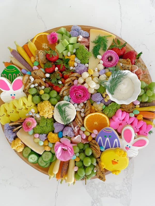An Easter charcuterie board idea from Carlonia charm that is dessert with candies, cookies, and more.