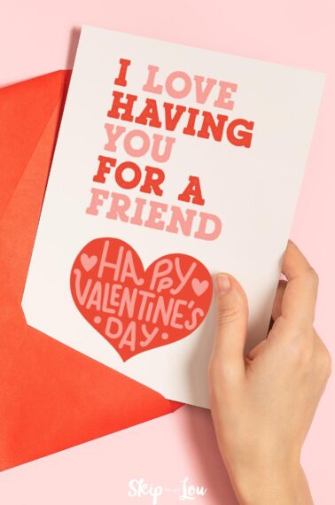 I love having you for a friend greeting card with hand holding the edge