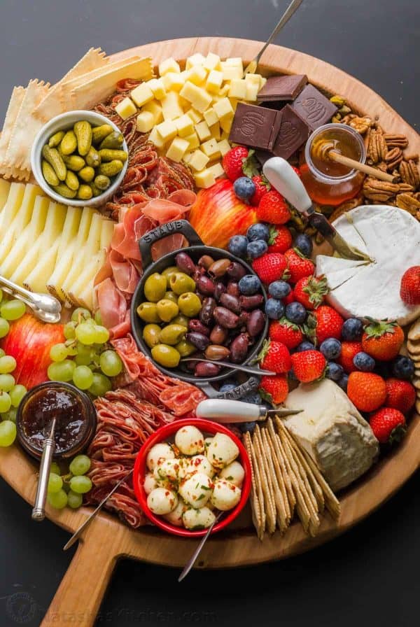 A round board with fresh berries, cheese, and meat from Natasha's Kitchen.