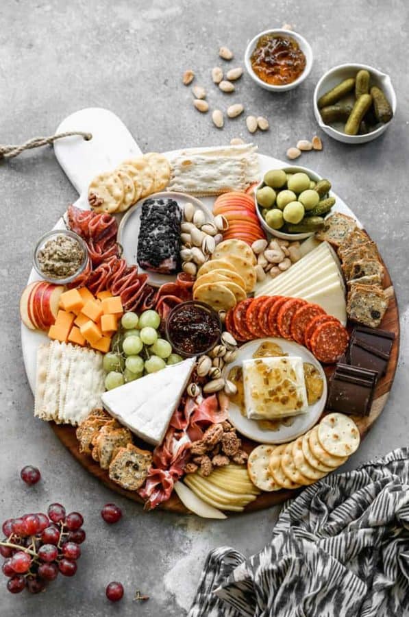 meat charcuterie board ideas from Tastes Better From Scratch that includes meat, cheese, chrackers, and more.