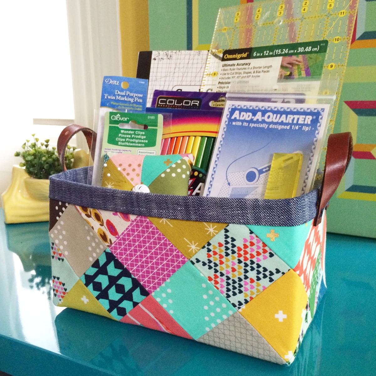 colorful patchwork basket with grown leather handles
