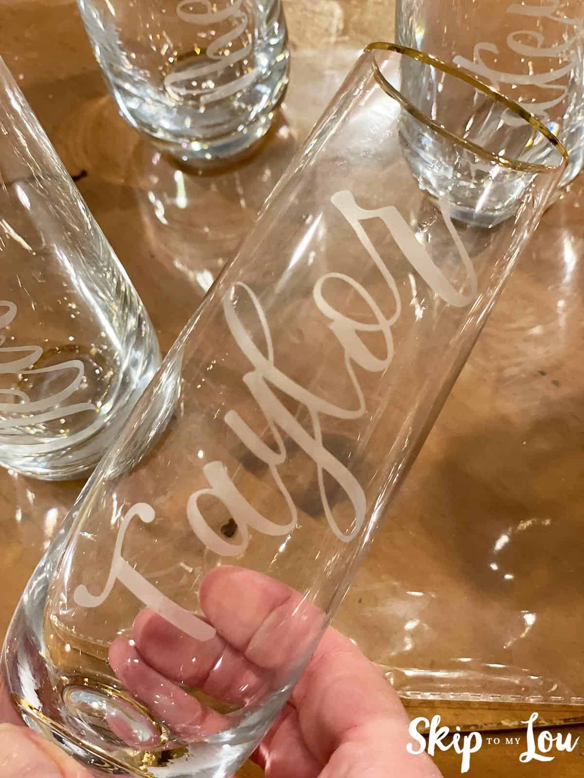 Stemless wine flutes etched with names, by Skip to my Lou.