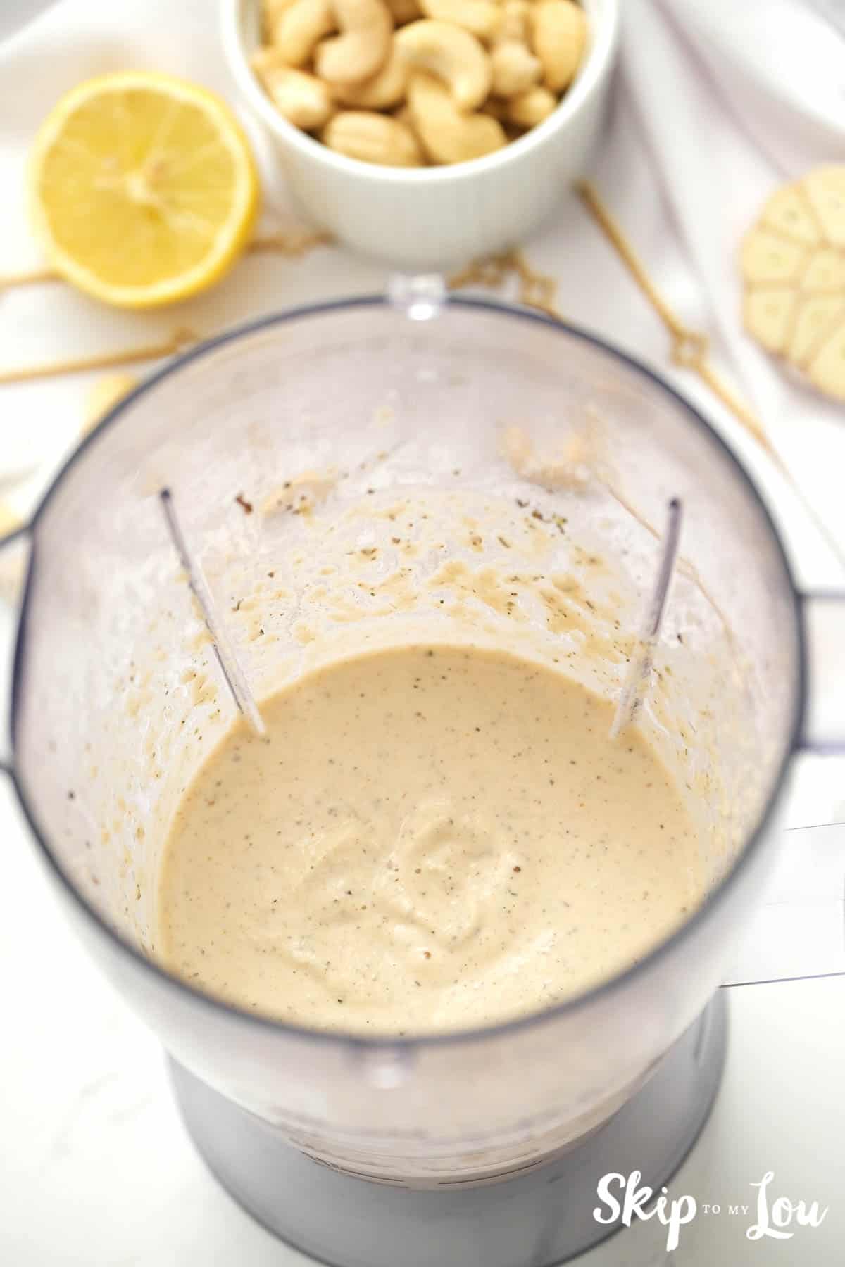 Dairy free creamy Italian salad dressing in a blended after being combined, by Skip to my Lou.