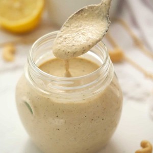 Dairy free creamy Italian salad dressing in a glass jar, by Skip to my Lou.