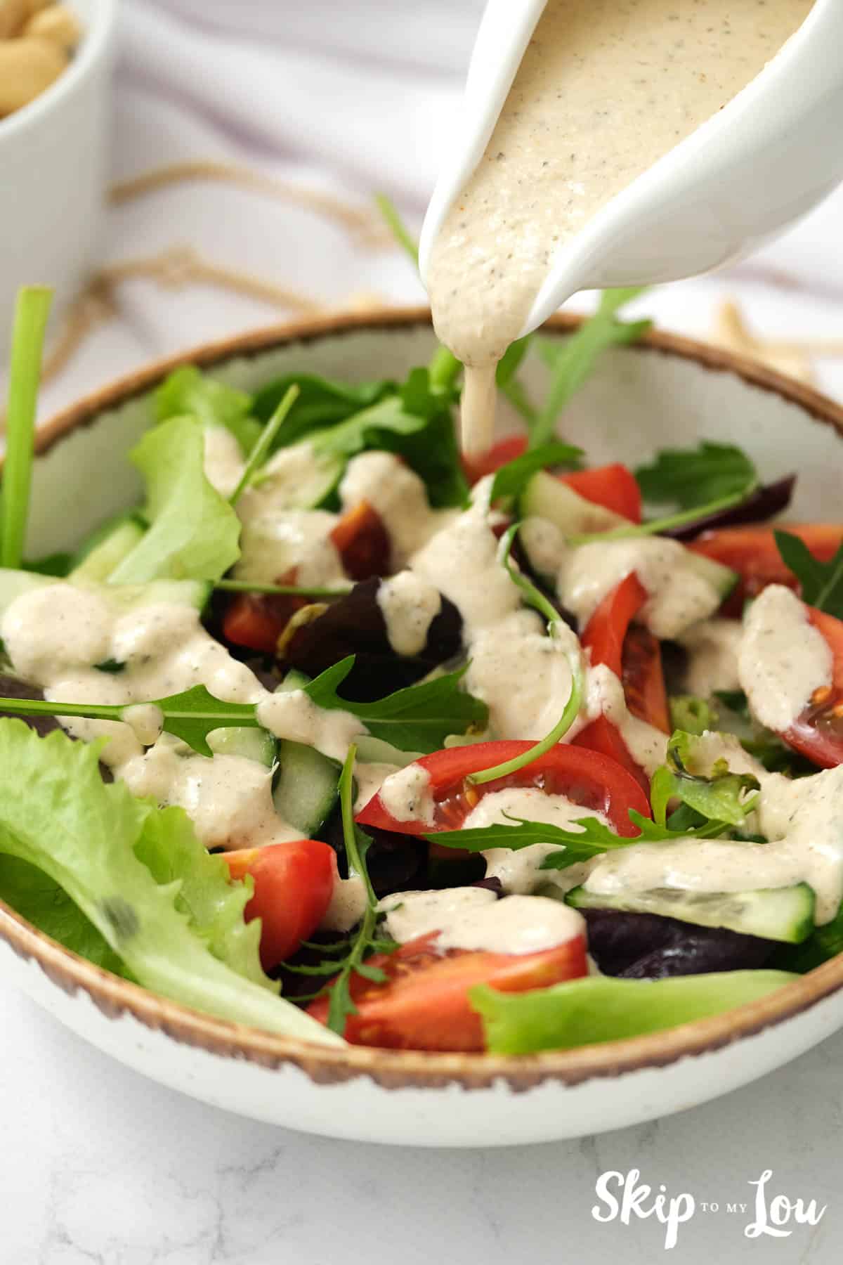 Romaine lettuce, tomato, arugula and radicchio salad dressed with dairy free Italian salad dressing, by Skip to my Lou.