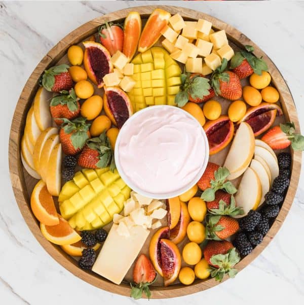fruit charcuterie board ideas-devour dinner-board with a variety of yellow options like mangos, pineapple, etc.