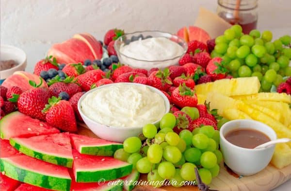 fruit charcuterie board ideas-entertaining diva-board with watermelon, pineapple, grapes, etc. and dips