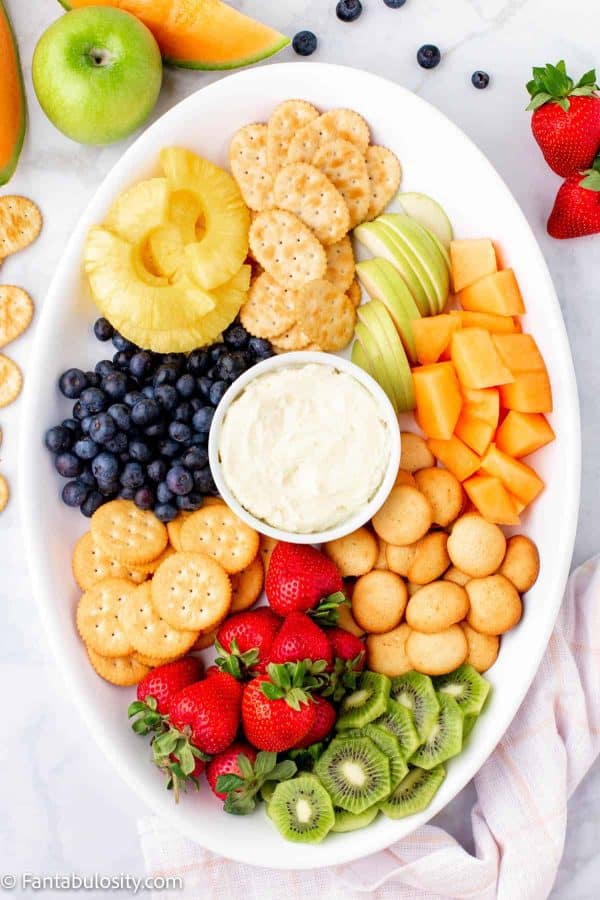 fruit charcuterie board ideas-fantabulosity-board with kiwi, blueberry, strawberries, and cookies.