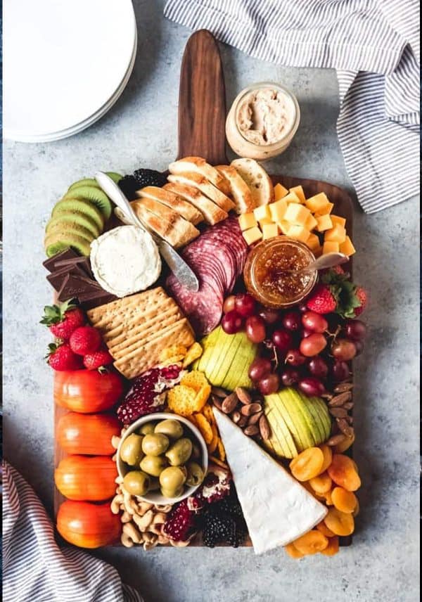 fruit charcuterie board ideas-house of nash eats-board with a variety of fruits, cheese, and crackers.