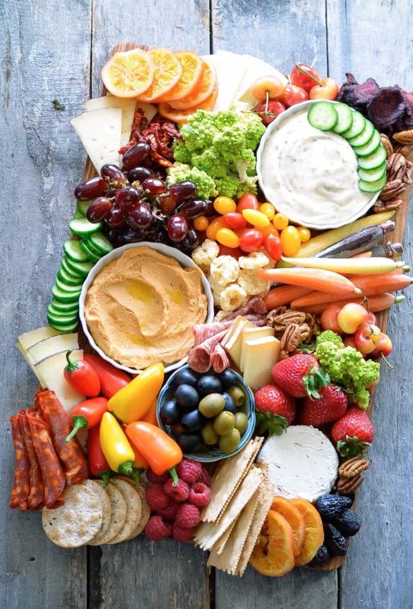 fruit charcuterie board ideas-karista bennett-board with a variety of dips, fruits, and veggies.