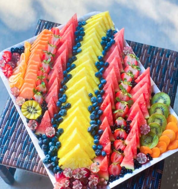 fruit charcuterie board ideas-skills share-board with fruit cut into triangles 