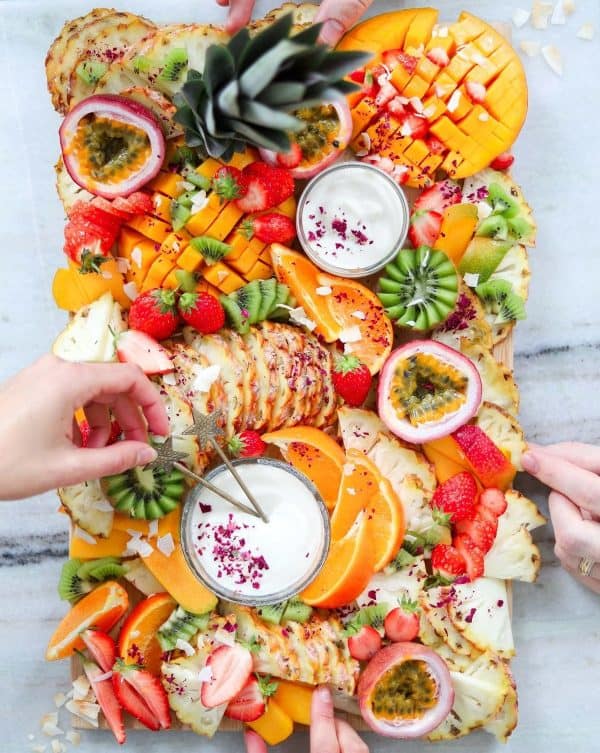 fruit charcuterie board ideas-two spoons-board with a variety of tropical fruits.