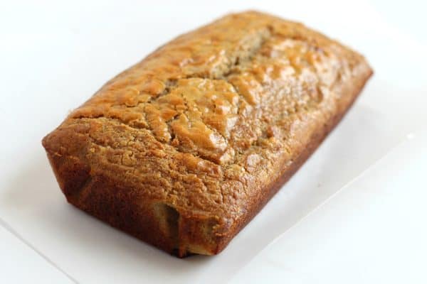 A loaf of gluten free, grain free and nut free paleo bread on a white countertop by Skip to my Lou.