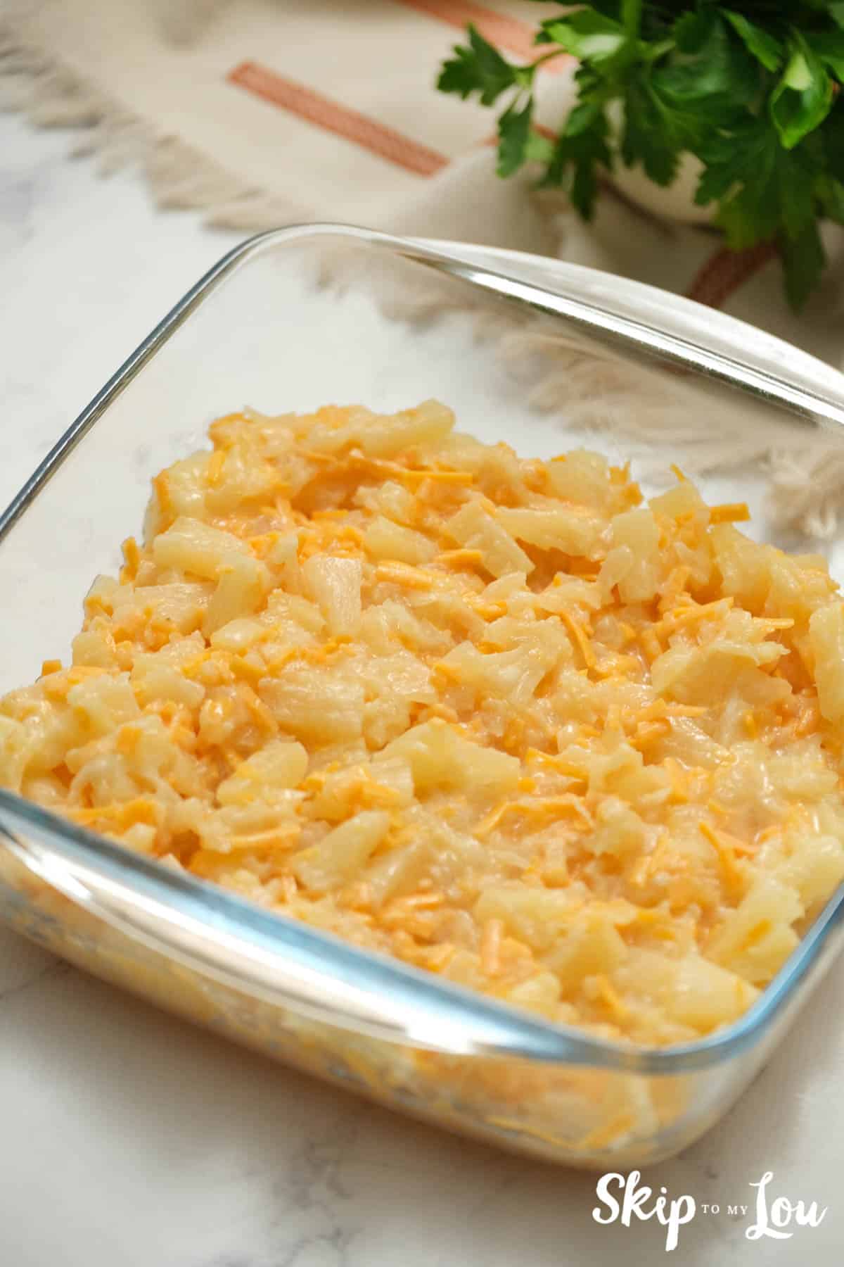 Pineapple Casserole with cheddar cheese, by Skip to my Lou.