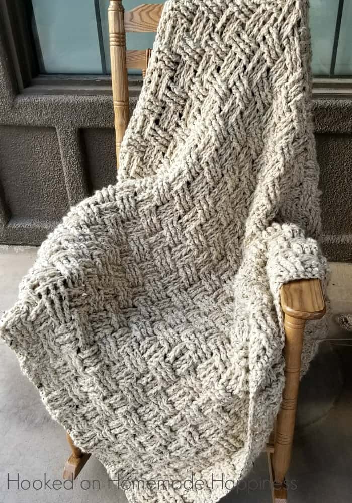 basket weave blanket laying on a chair