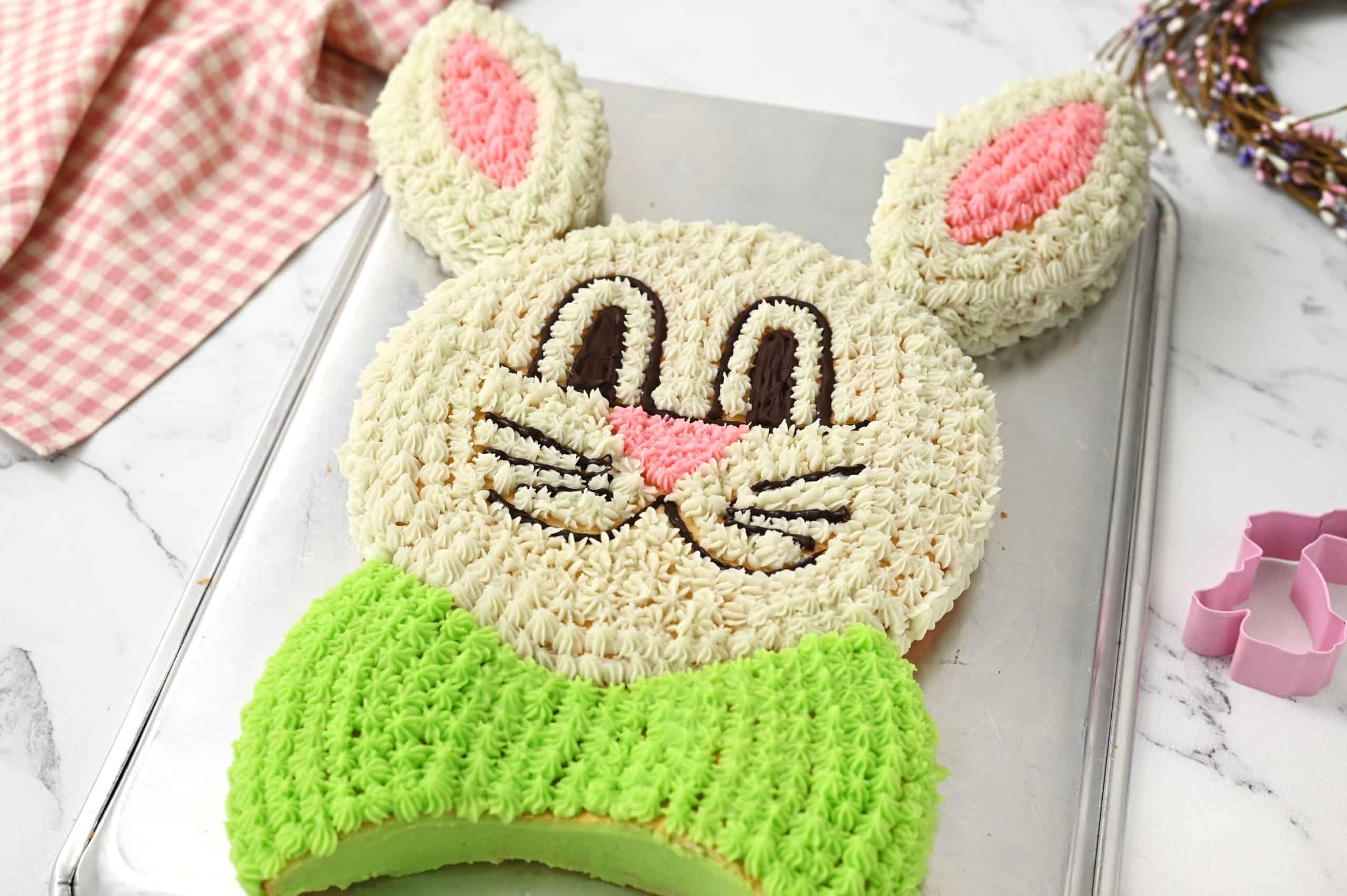 darling easter bunny cake on baking sheet