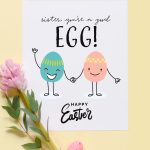 Image shows a printed Happy Easter sister greeting card decorated with pink and green eggs over a yellow background. From Skip to my Lou
