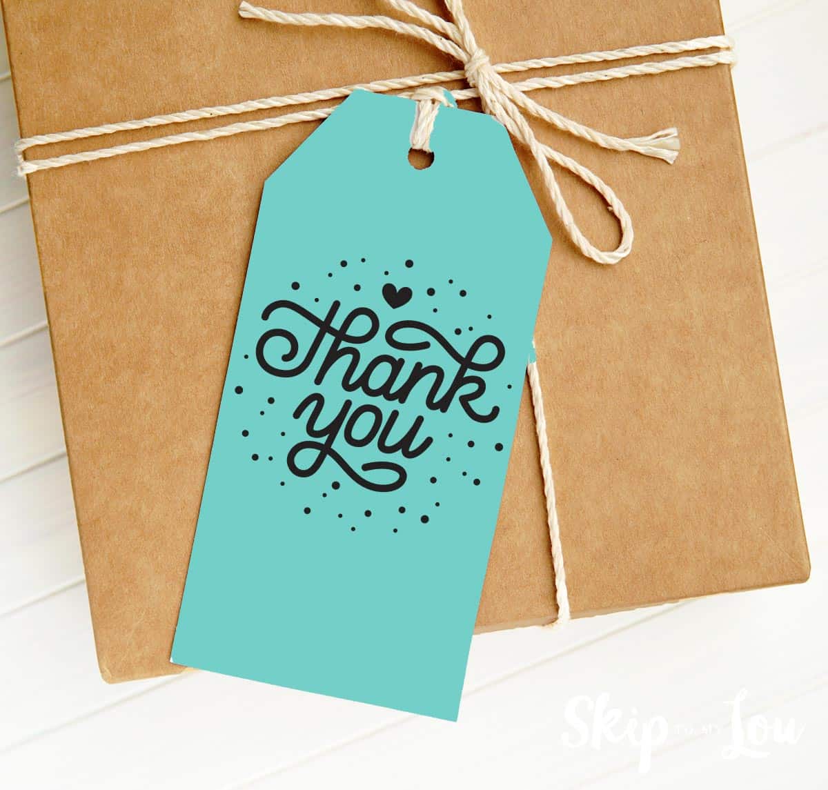 Printable Thank you tag tied to a nice string on top of a present.