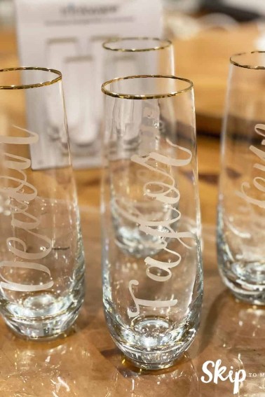 Stemless wine flutes etched with names, by Skip to my Lou.