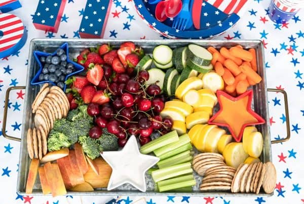 a veggie board with some red, white, and blue star shaped dip bowls from arina photography. 